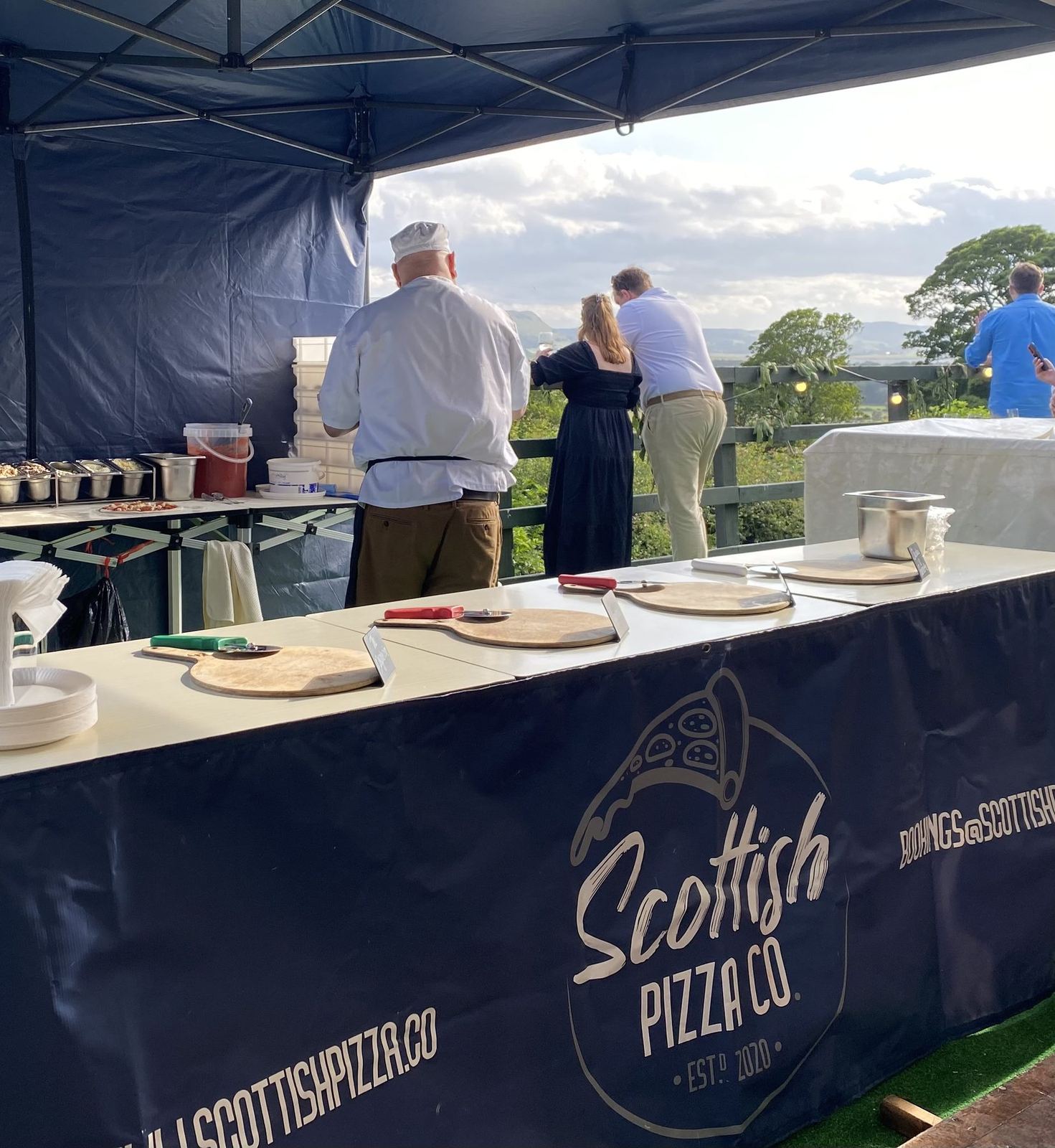 Guests at the Scottish Pizza Co pop-up counter at a corporate event