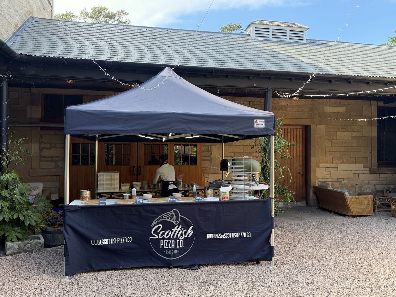 Scottish Pizza Co 3m gazebo pop-up in a courtyard with fairy lights