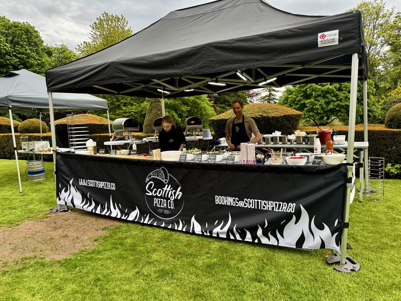 Scottish Pizza Co 4.5m outdoor pop-up station on a lawn at a garden event